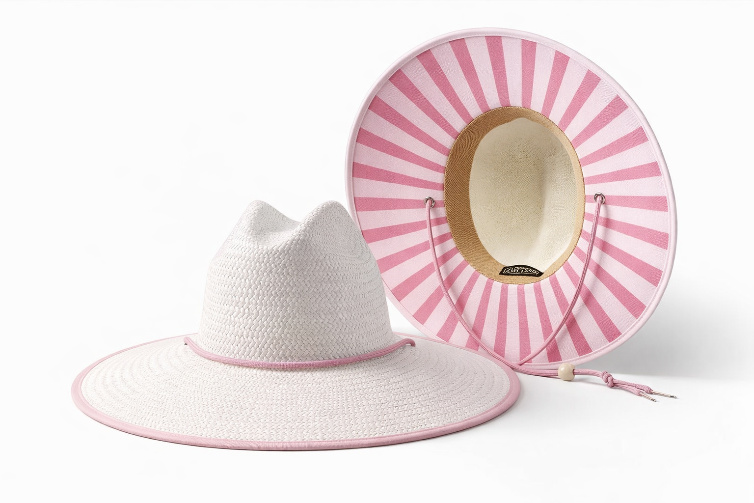 White sun hat with pink striped underside detail close-up